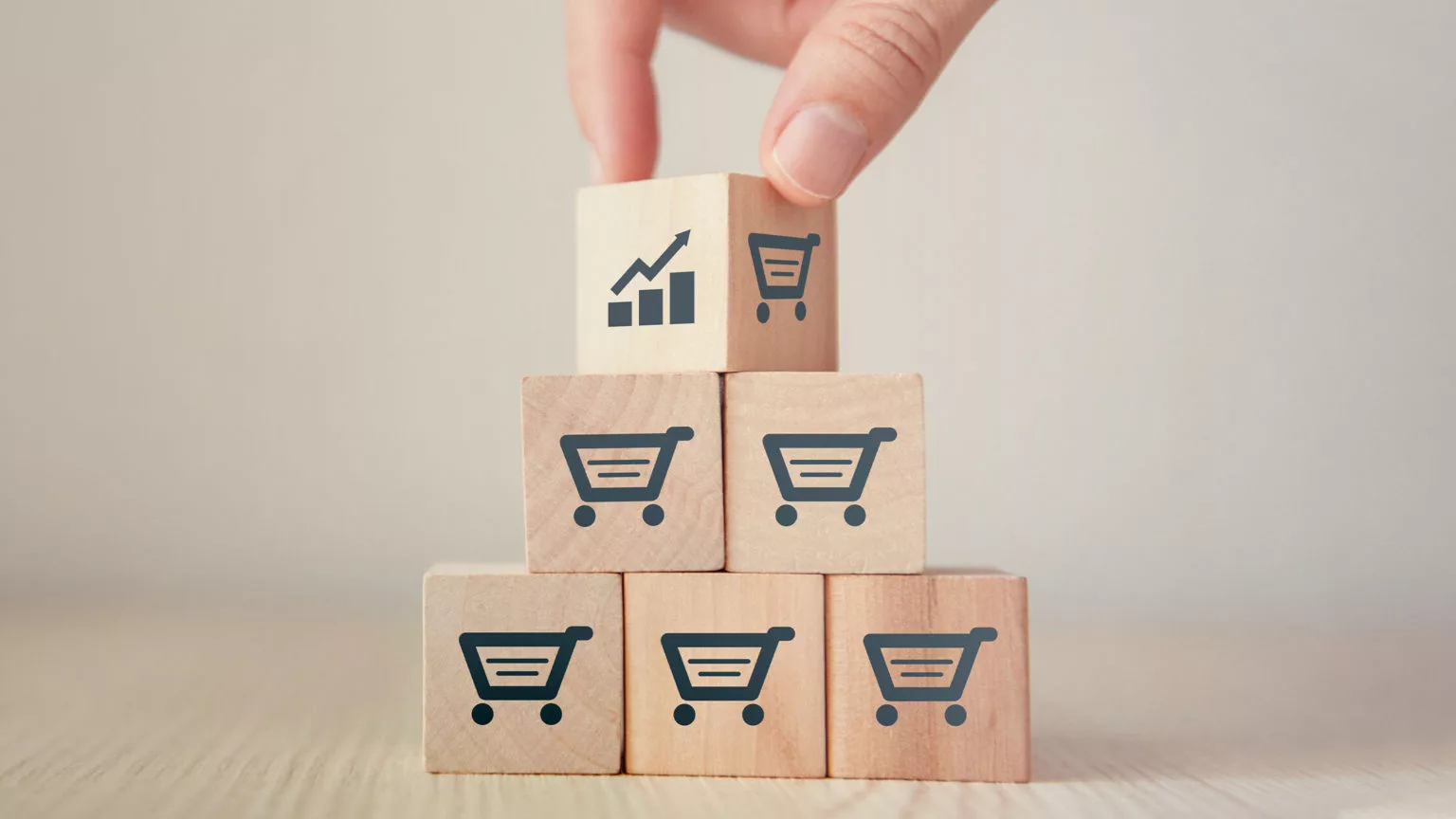 person stacking up blocks representing the 10 amazon fba tips