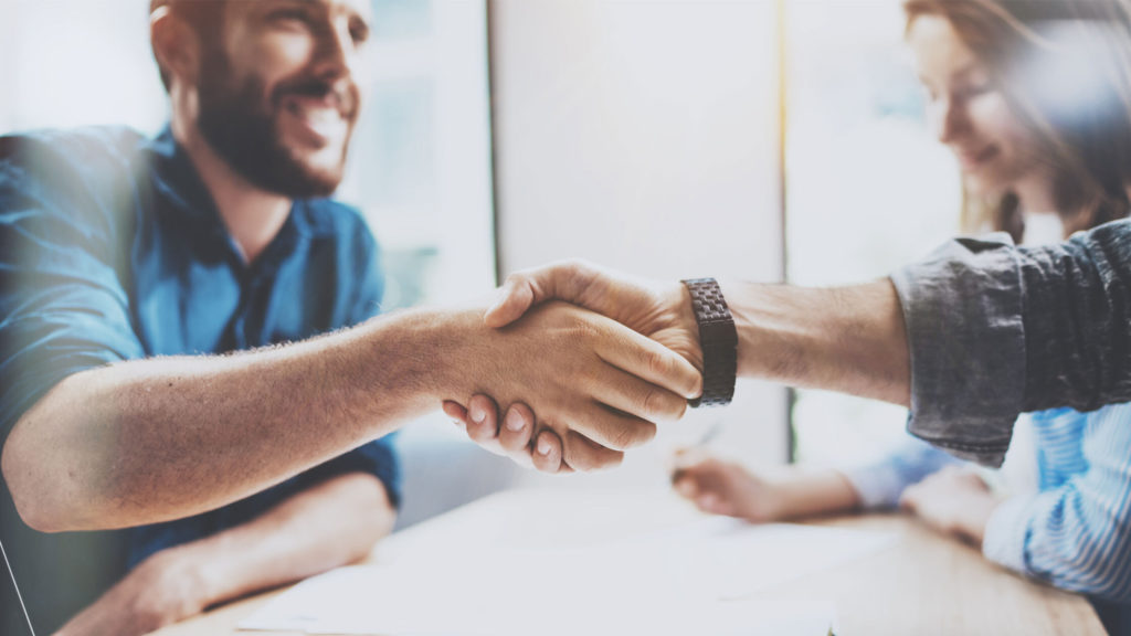 two people shaking hands